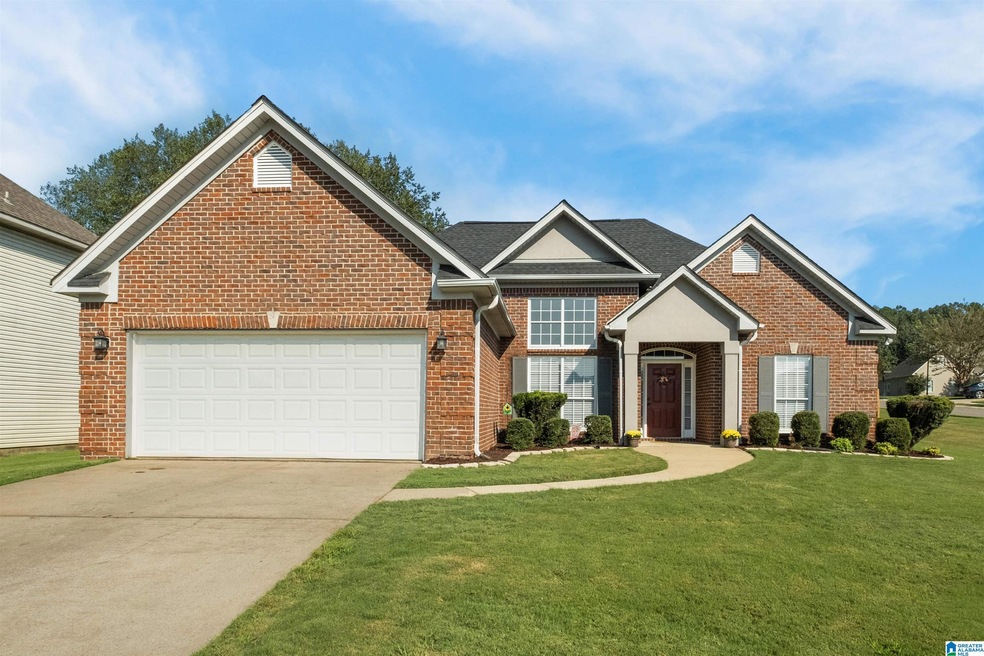3-sided brick well maintained home