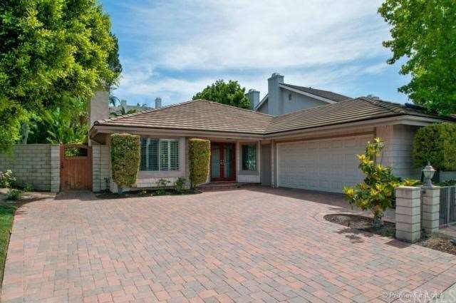 Over sized corner lot with brick driveway