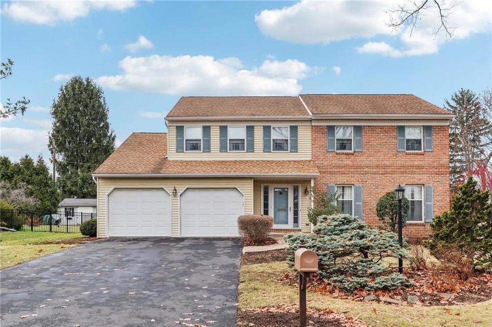 Front of house with 2 car garage and generous driv