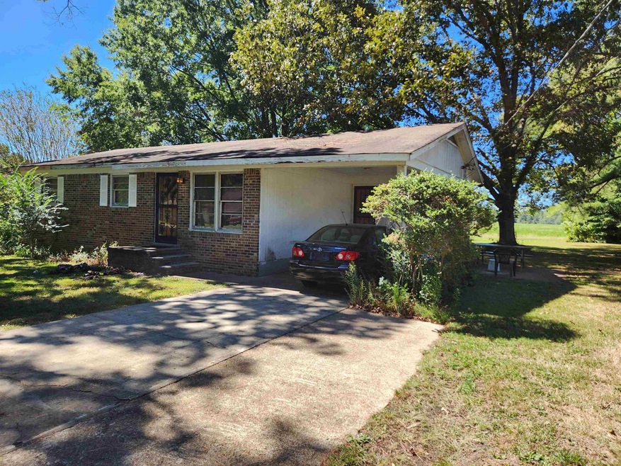 View of front of house with a carport and a front 
