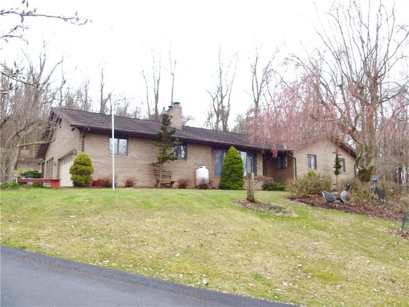 This all brick ranch sits atop a private 3 acre pa