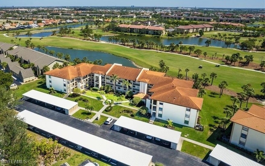 Aerial view of residential area with a large body