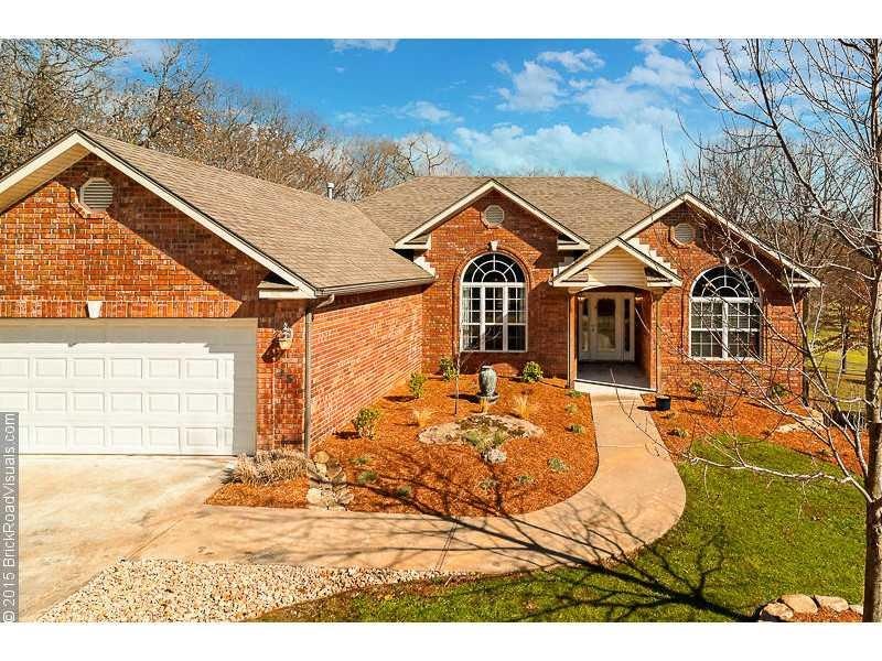 Exterior Front. Beautiful home nestled in the trees of Bella Vista!