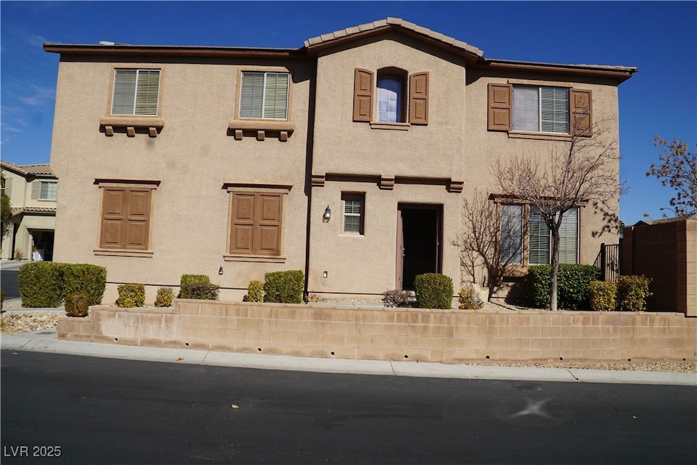 View of front of house featuring stucco siding