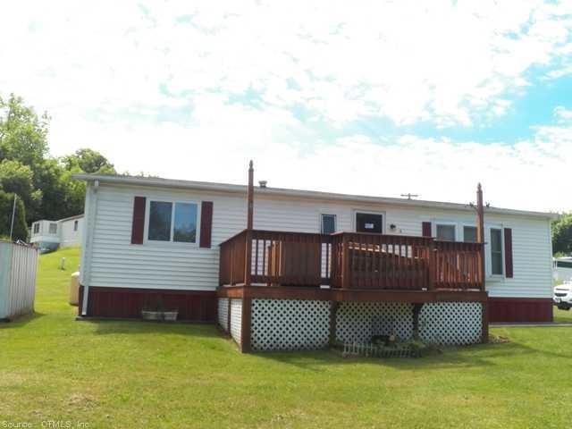 Exterior Front. Nice large deck on the spacious ho