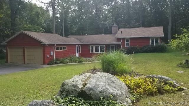 Perennials and natural landscaping frame the home'