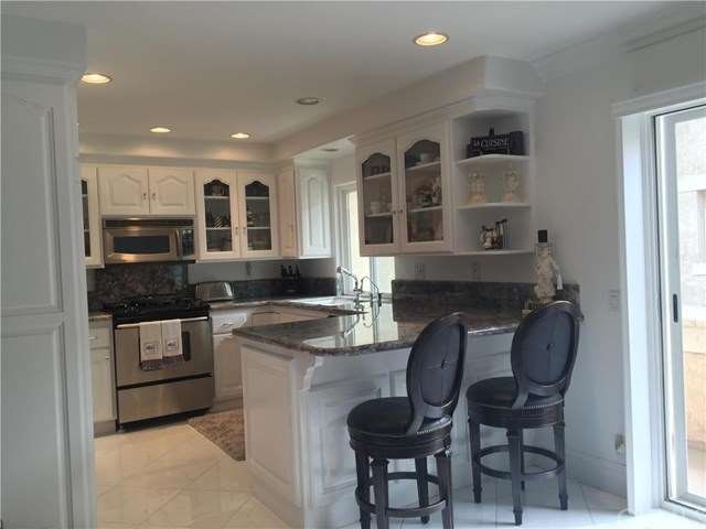 Spacious and upgraded Kitchen with slider to balco