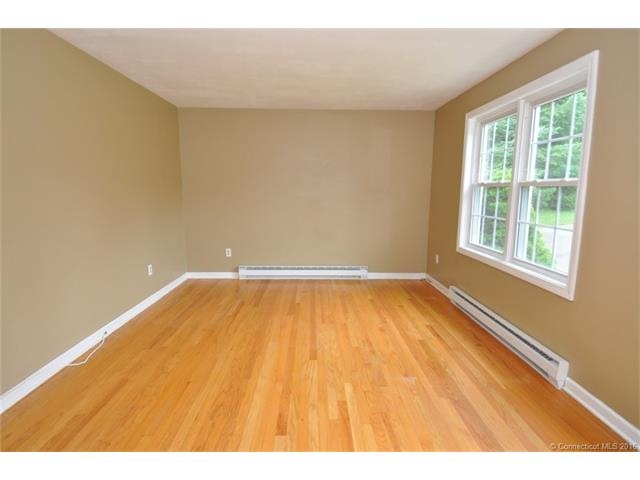 View of livingroom with hardwood floors. Bright an