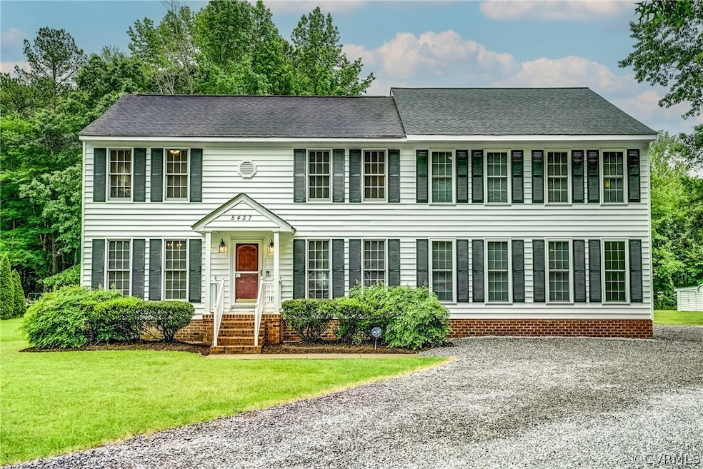 Colonial home with a front lawn
