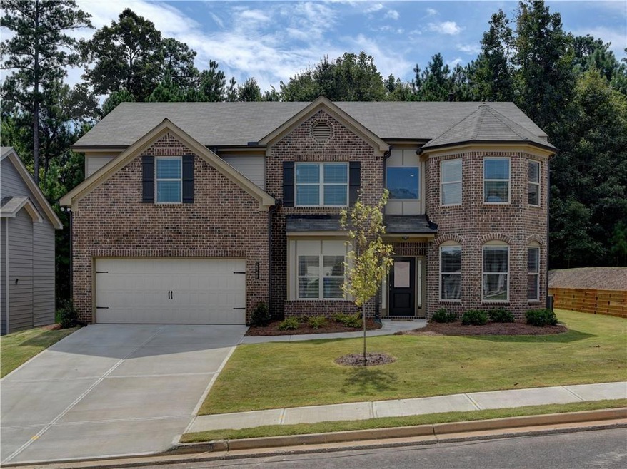 View of front of home featuring a front lawn and a