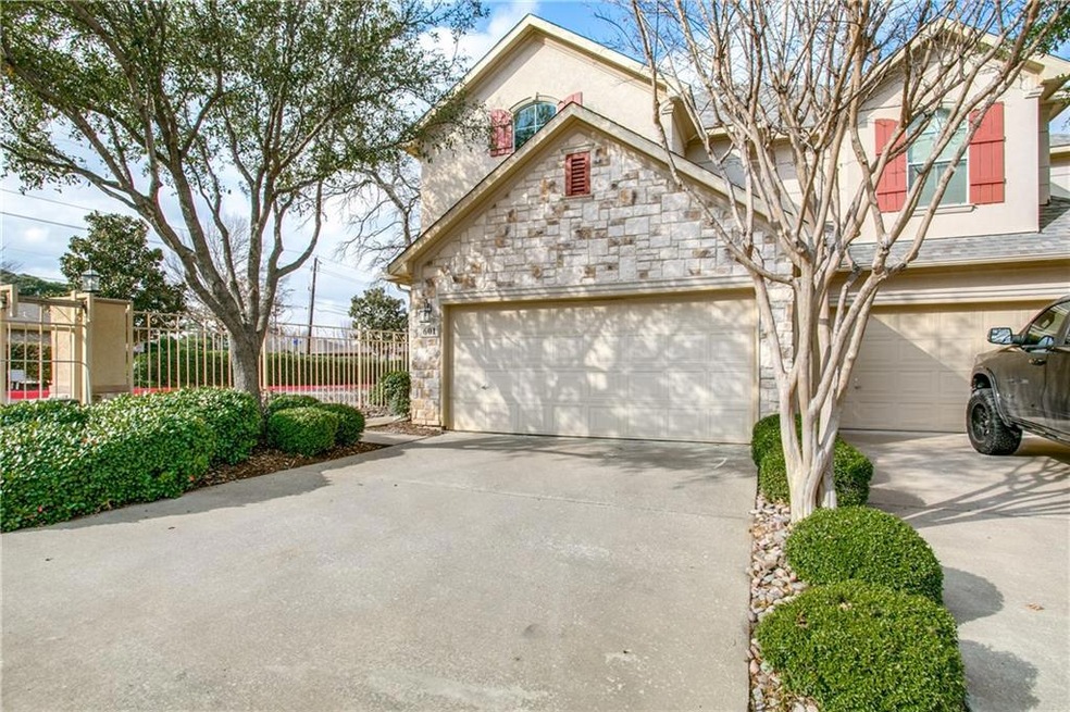 Front with oversized two car garage and long drive