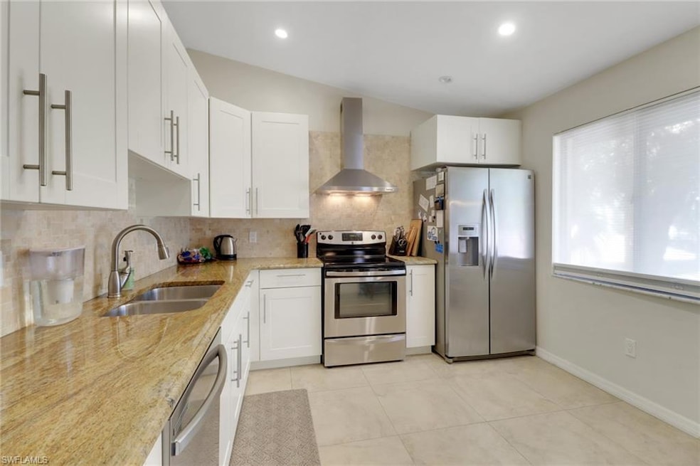 Beautifully updated kitchen. Stainless steel appliances, white shaker cabinets, large window with tons of natural light, desk space.
