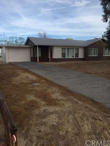 Front of Home with Long Driveway.