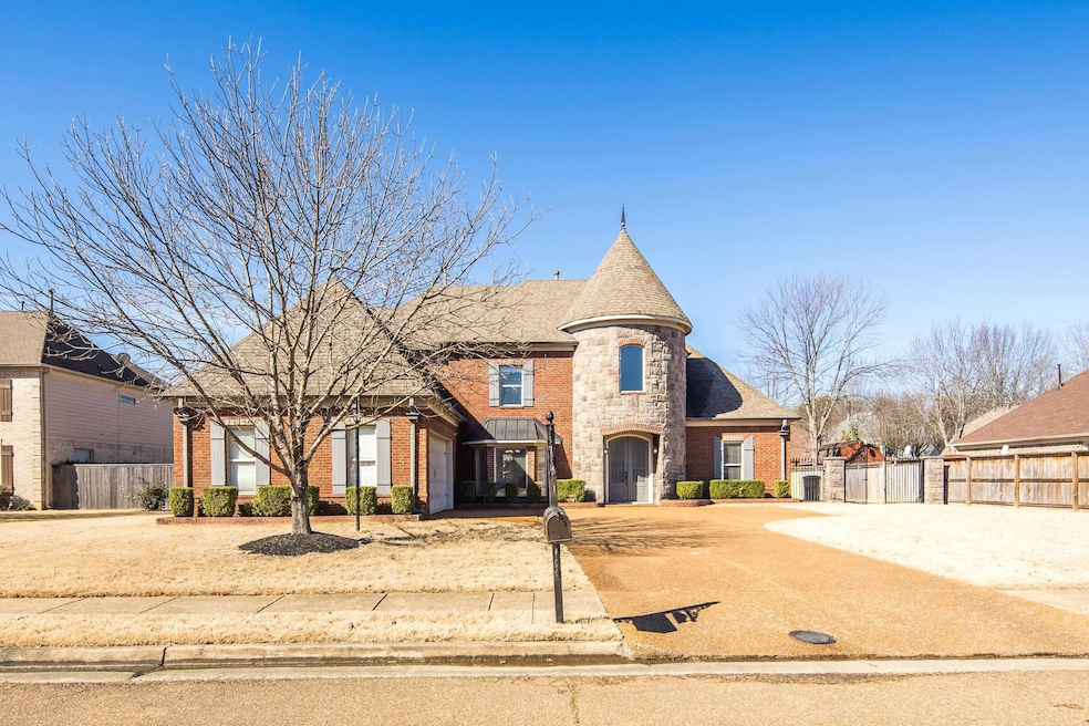 French country inspired facade featuring driveway,
