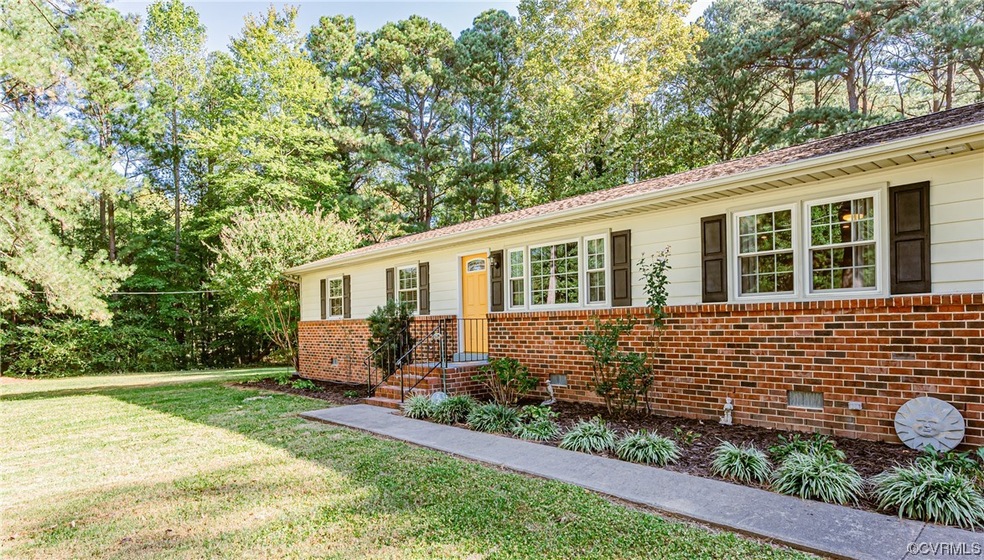 Ranch-style home with a front lawn