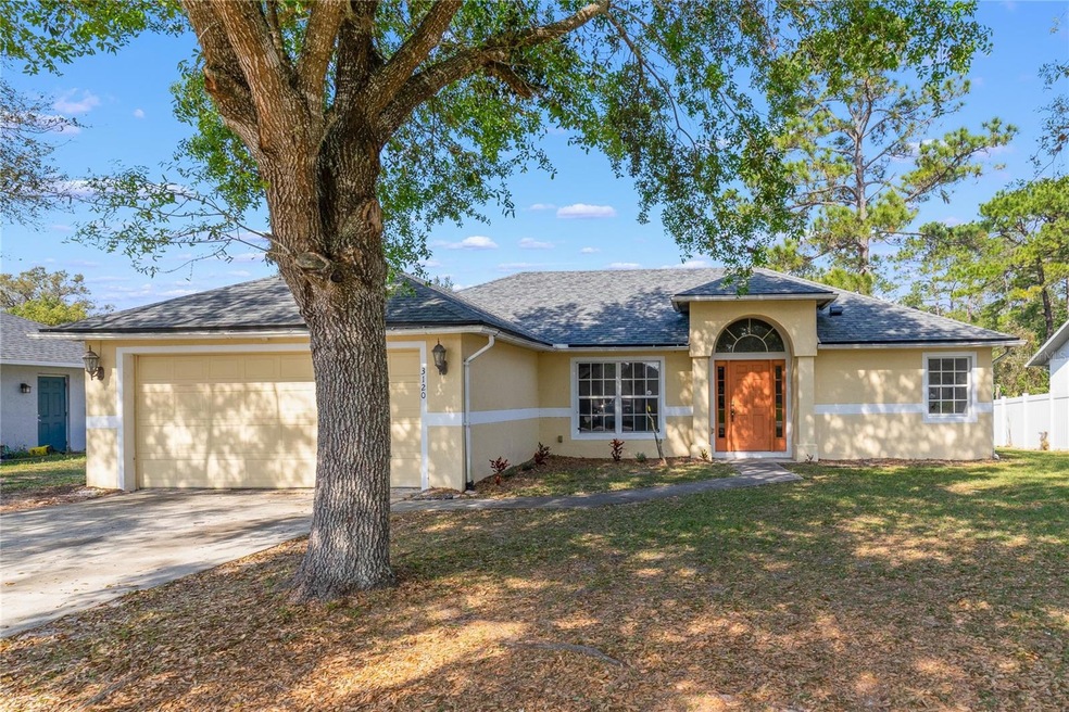 Welcome to Deltona Lakes and this 3BD/2BA home on a spacious lot that offers WOODED VIEWS, plus a BRAND NEW ROOF (2022!), SPLIT FLOOR PLAN with NEW CARPET and NO HOA!