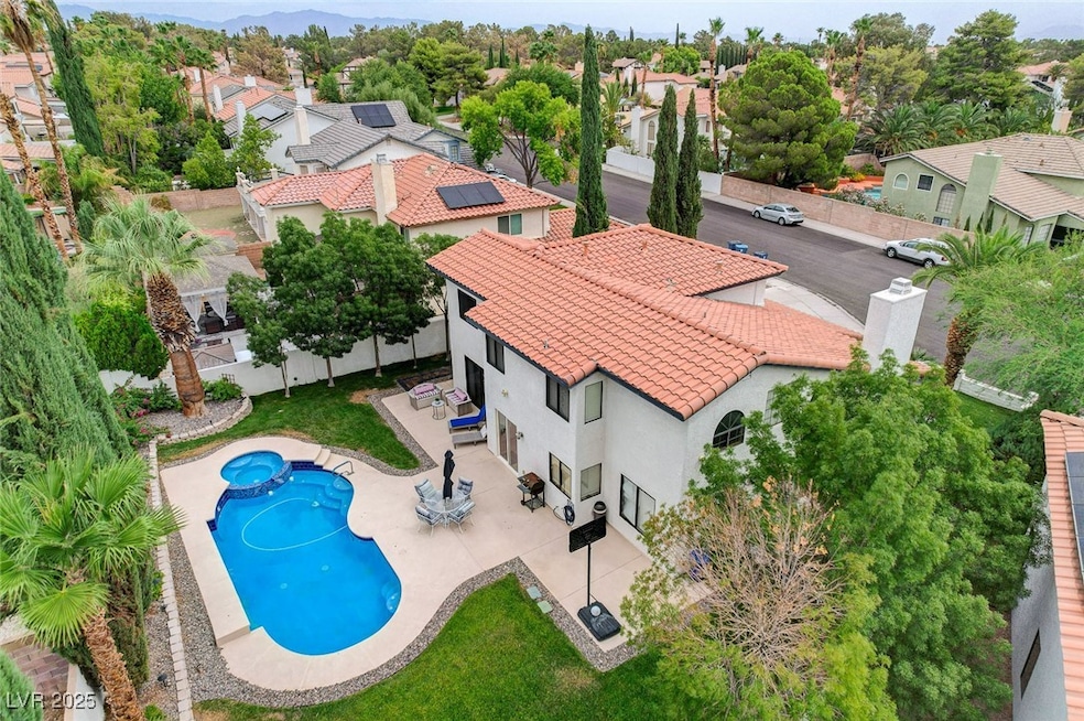 Aerial view of residential area featuring a pool