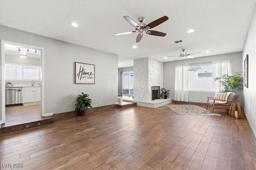 Unfurnished room featuring a textured ceiling, a s