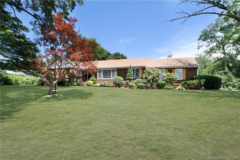 Front view featuring mature specimen plantings.