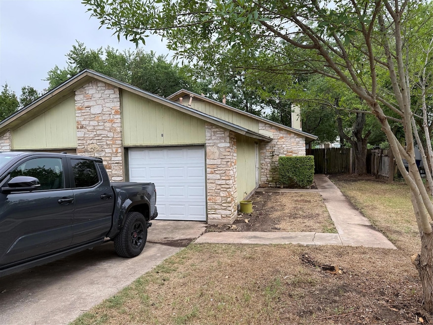 View of property exterior with stone siding, an a