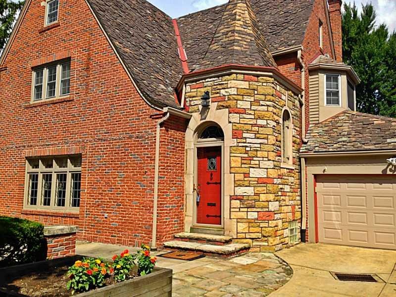 Exterior Front. Brick and Stone Tudor