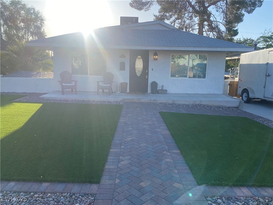 View of front of house featuring stucco siding and