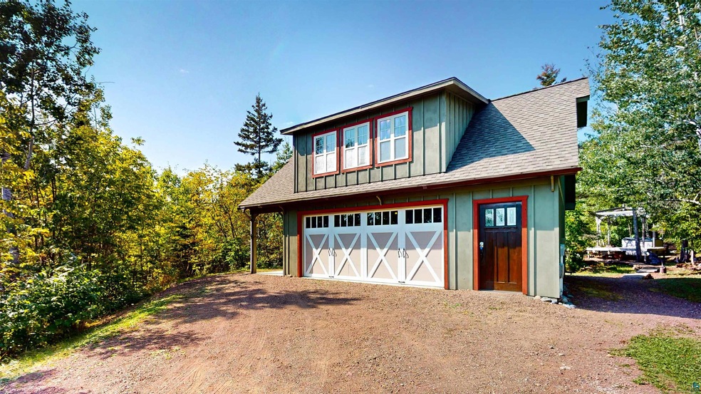 Exterior space featuring an outbuilding and a gara