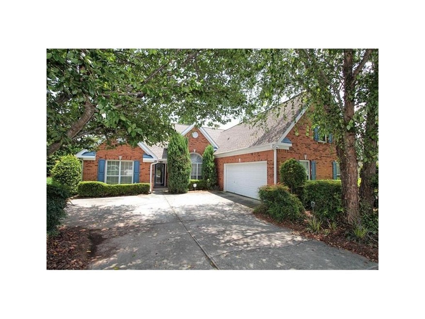 Brick front with level driveway & courtyard garage