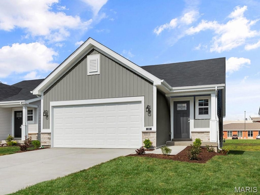 Ranch-style house with a garage, concrete driveway, a porch, and board and batten siding