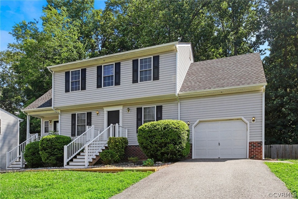 Exterior Of Home w/ Paved Drive & Garage