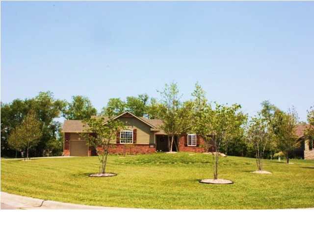 12502 E Zimmerly Ct. IS SITUATED ON OVER 1/2 AN AC
