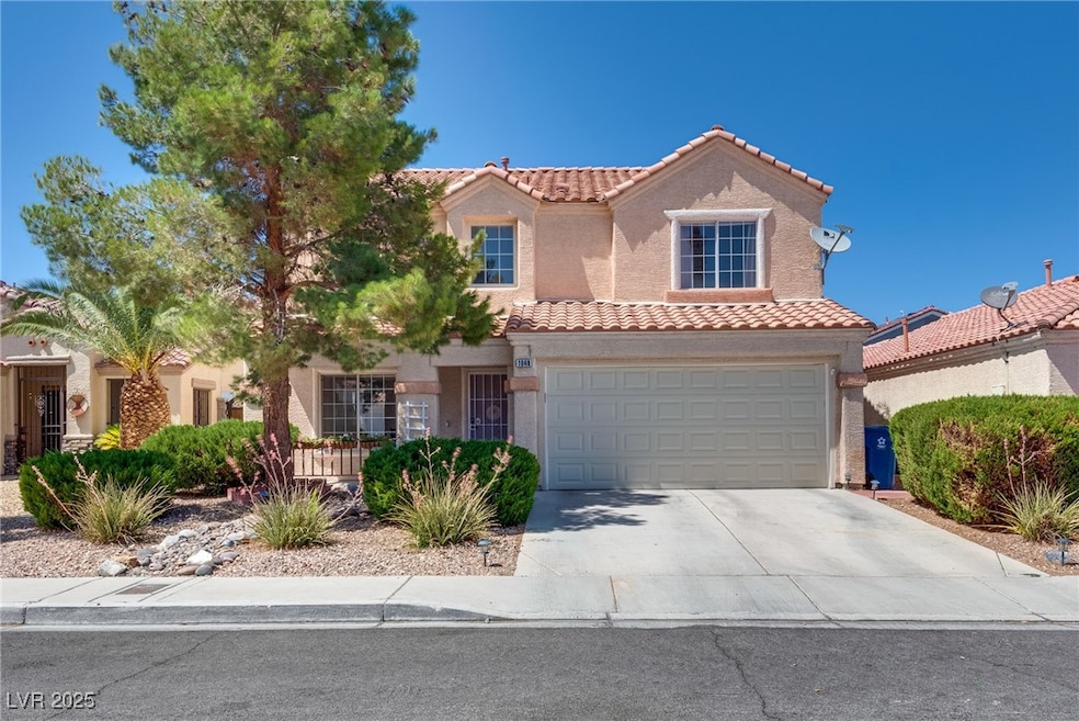 Mediterranean / spanish-style home featuring a til