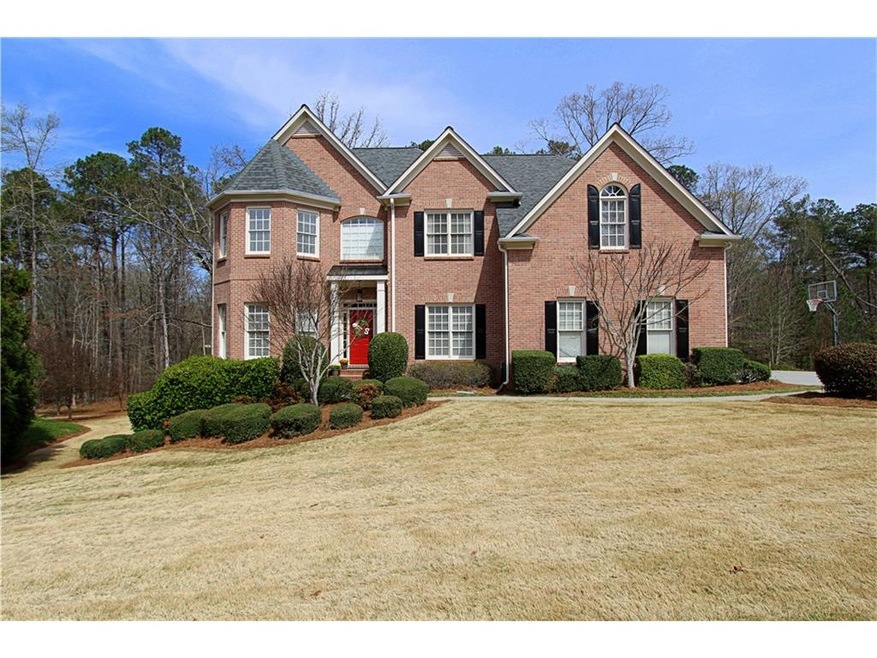 Stately updated 3 sided brick home with side entry
