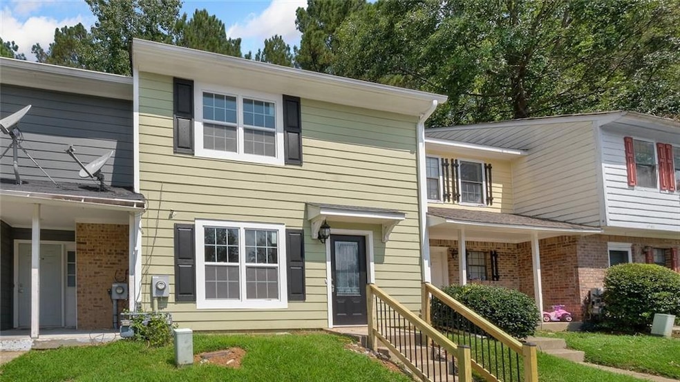 Townhome / multi-family property with brick siding