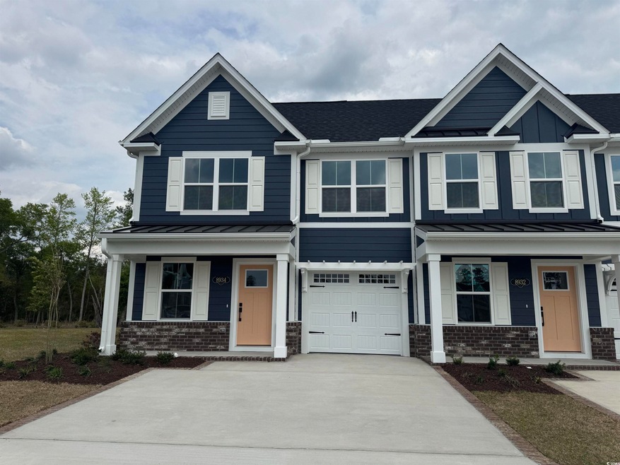 View of front of house with a standing seam roof, 