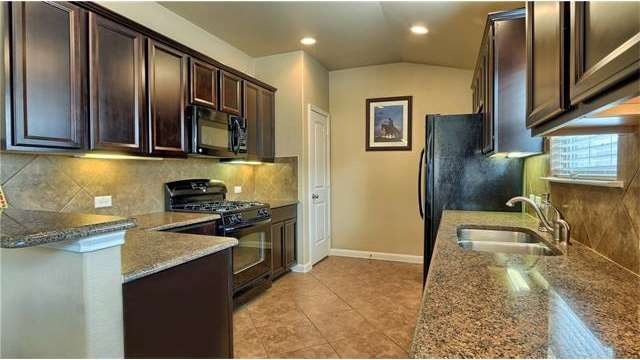 Granite all around, recessed lighting plus under c