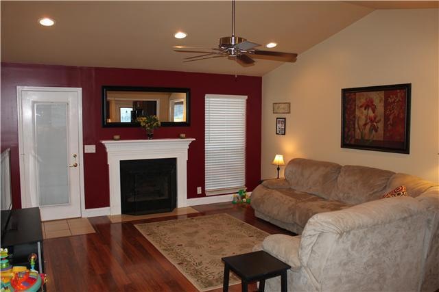 Welcome Home to this Fabulous Living Room with new flooring, neutral paint, gas fireplace and vaulted ceiling.