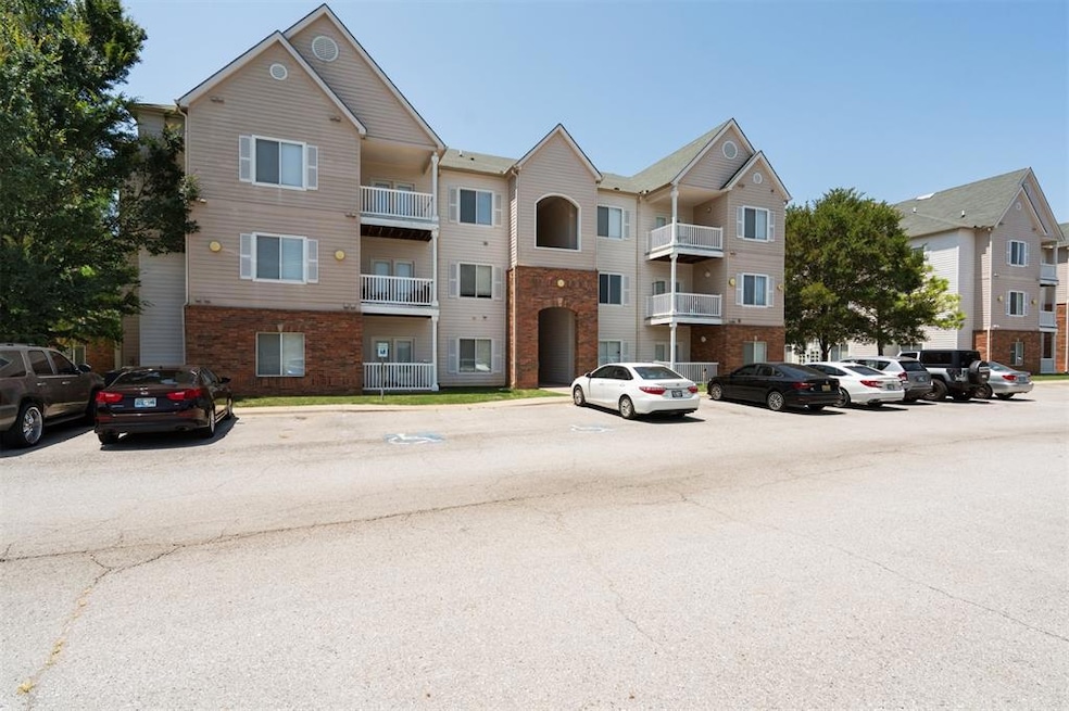View of property with uncovered parking