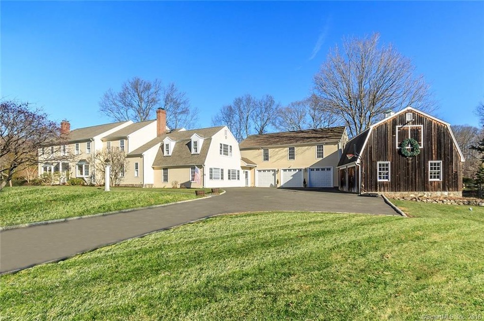 Wonderful curb appeal behind a lovely stone wall i
