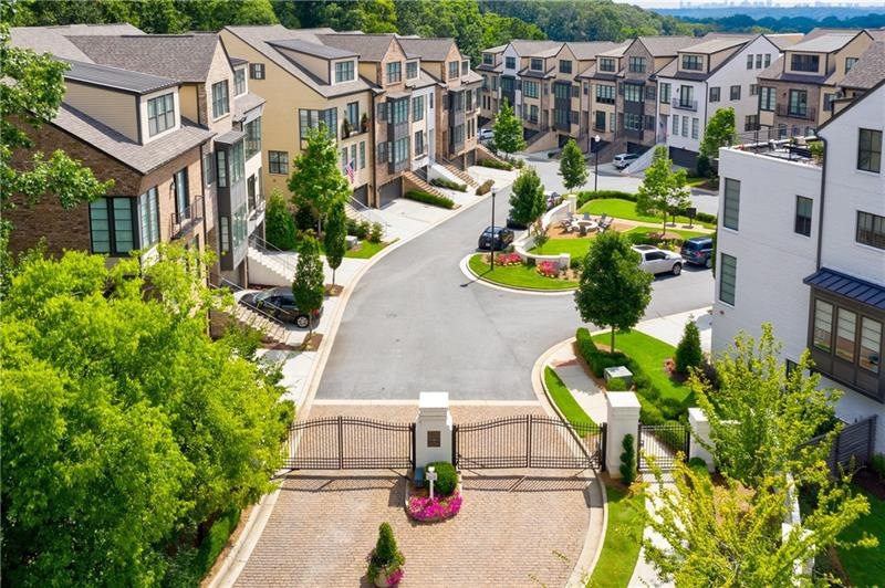 Gated seclusion yet steps from dining and shopping