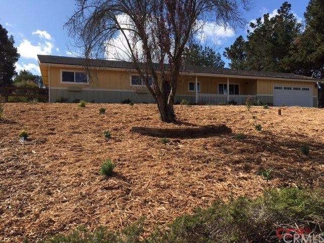 Front of home with new drought tolerant landscapin
