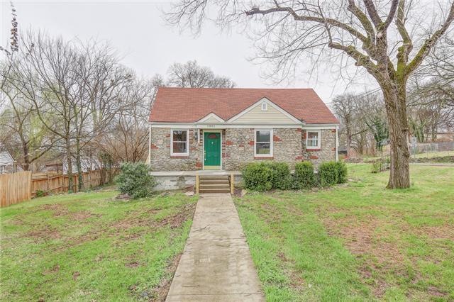 Cute stone Cottage! Porch rails will be stained an