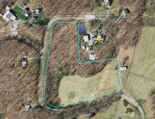 5.58 acres partially wooded and slightly sloping lot the property for sale is outlined in green.  The property with the buildings is also available.