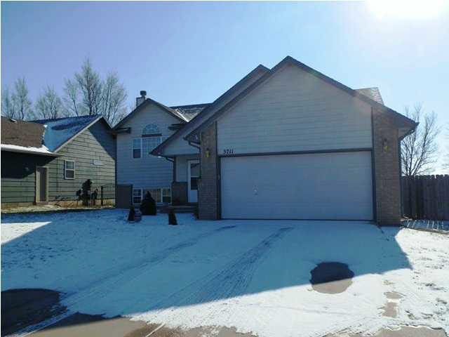Front view with 2 car garage