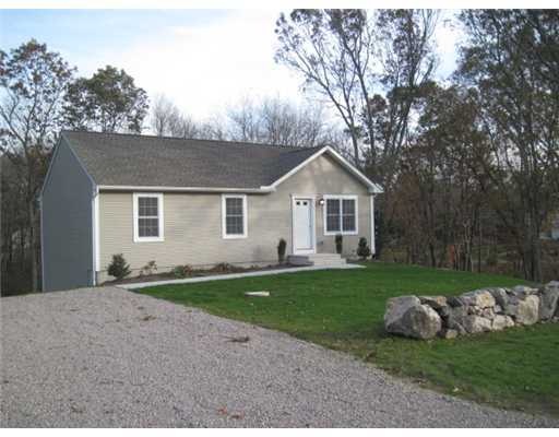 Exterior Front. Home is set on large corner lot wi