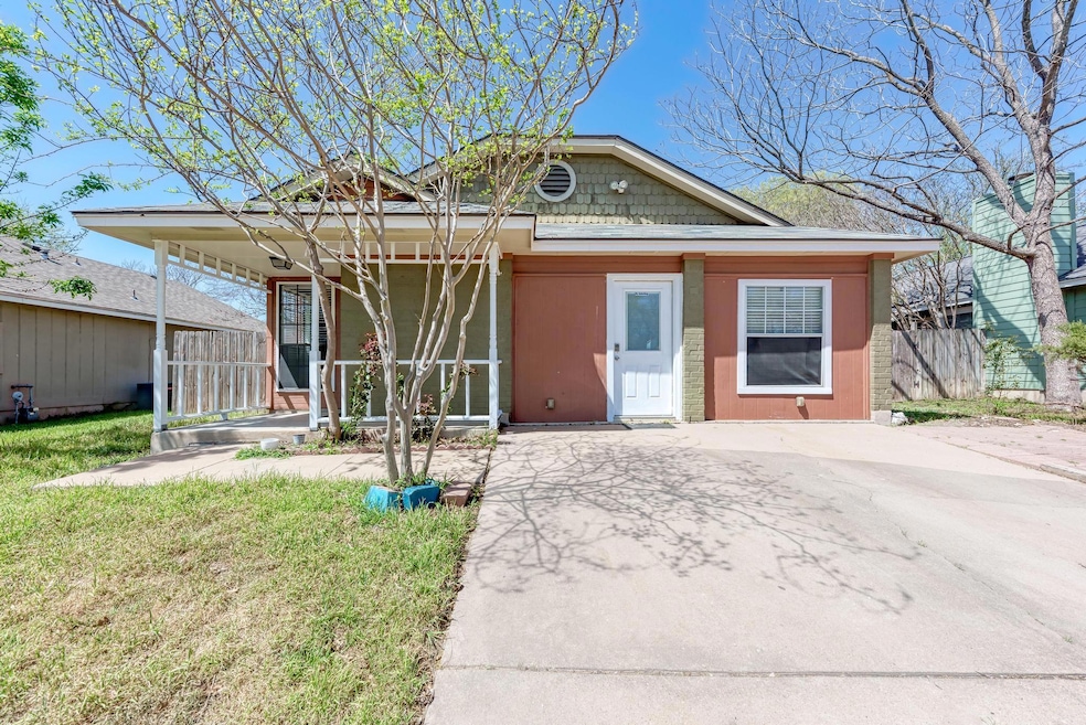 Bungalow-style home with covered porch, a front l