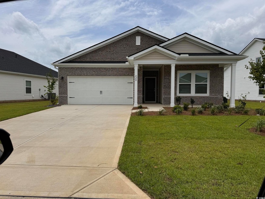 View of front of property featuring a garage and a