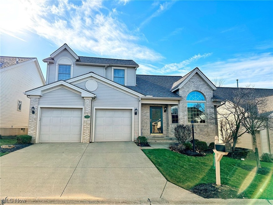 Front facade with a front yard and a garage