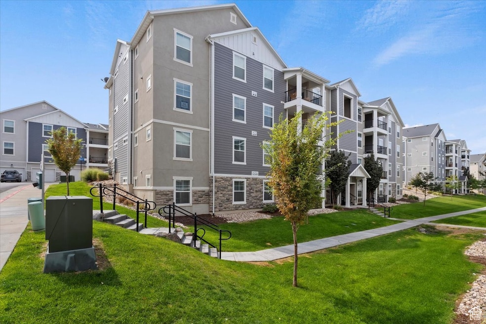 O201 End Unit on Second Floor Surrounding community with a residential view and a yard. Corner Unit second Level.