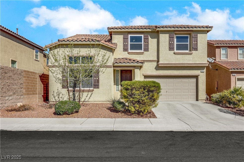 Mediterranean / spanish home with driveway, a tile